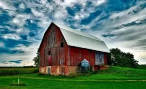 red barn with clouds